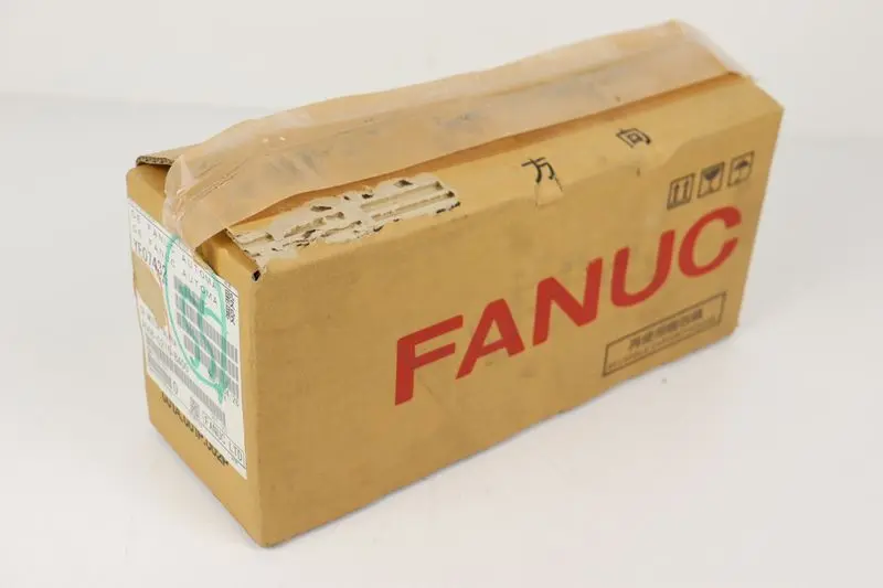 Produktfoto 1 von Fanuc AC Servo Motor A06B-0215-B400 4000min UNUSED & OVP